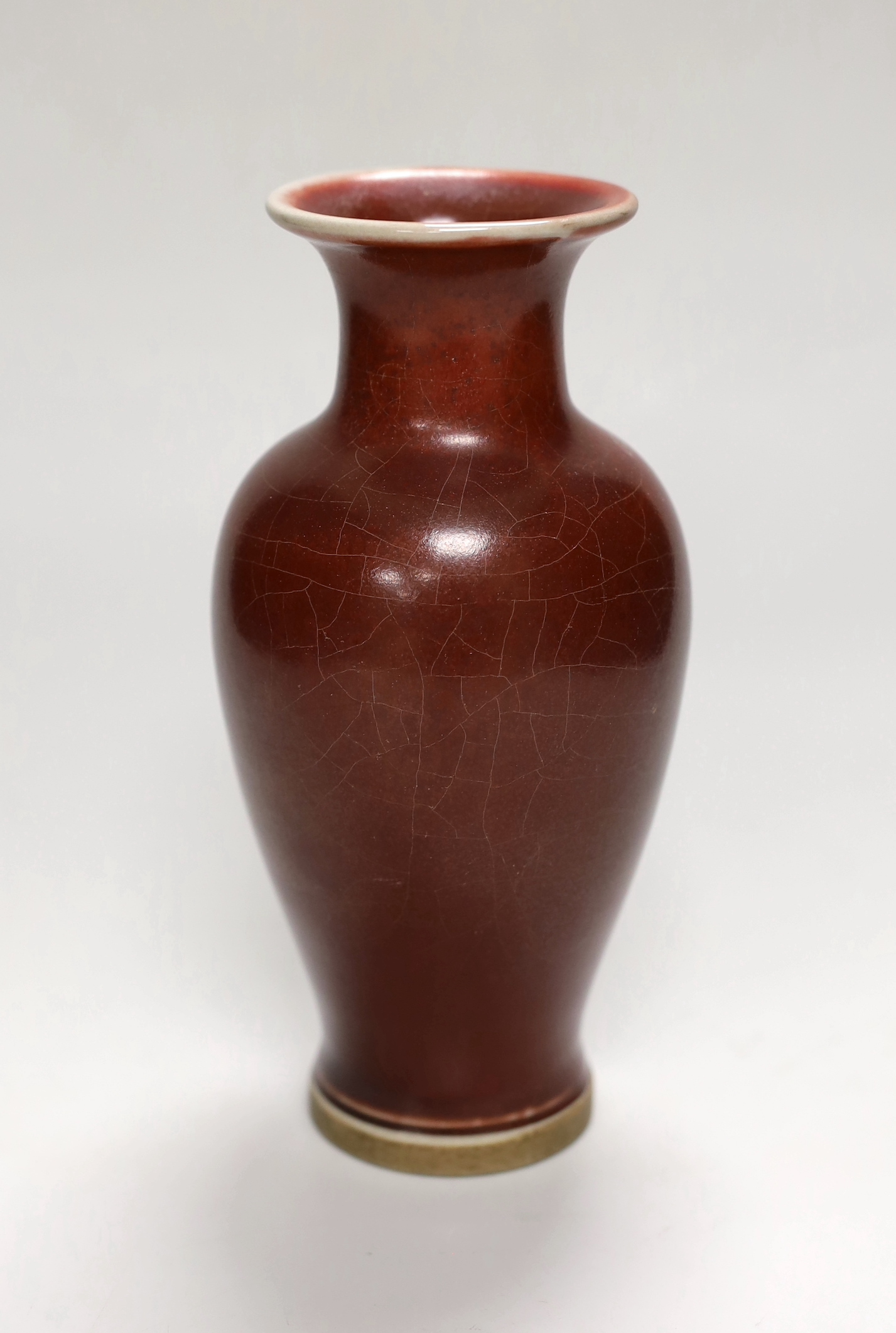 A Chinese sang de boeuf baluster vase, 18.5cm